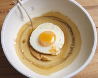 In a bowl, whisk together almond flour, baking powder, and a pinch of salt. In a separate bowl, mix egg, almond milk, vanilla, and maple syrup.